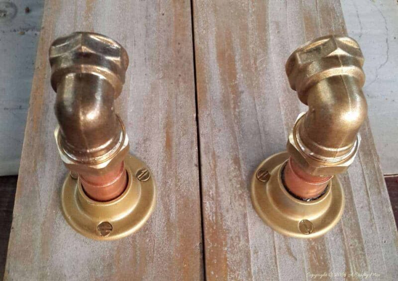 Screw the flange into the scrap wood