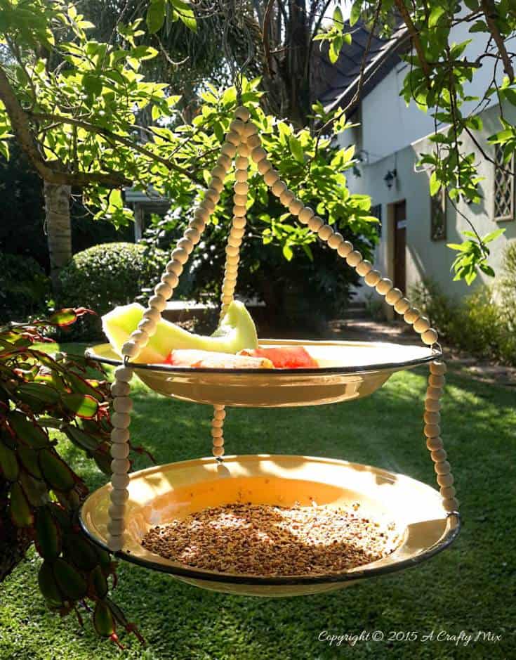 DIY an enamel plate bird feeder. Quick and Easy Garden Craft #BirdFeeder #EnamelPlateRepurpose #GardenCrafts #EnamelBirdFeeder #ACraftyMix
