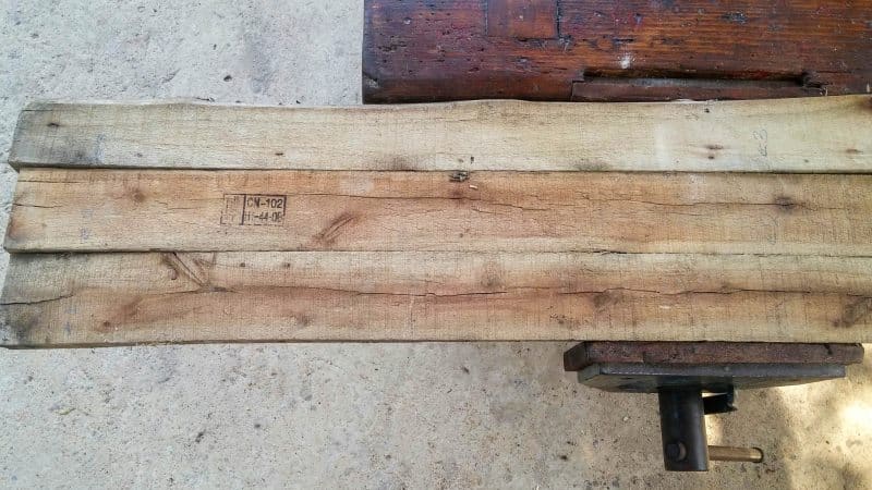 Three pallet planks side-by-side in a vice
