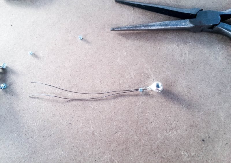 Add a small bell and bead
