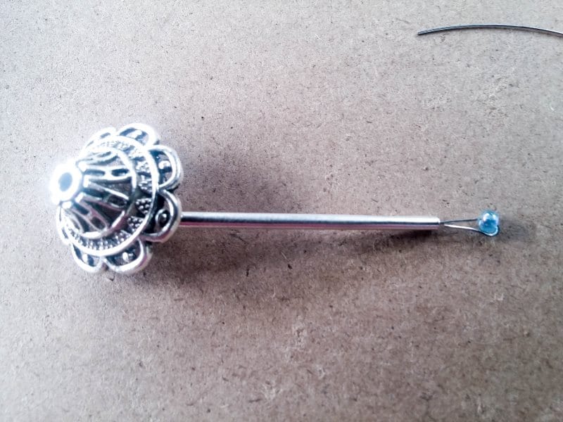 Add a tube bead and a seed bead to make the fairy wind chimes
