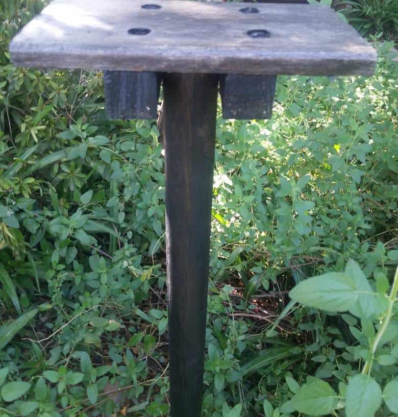 Place the bird bath platform on top of the pole