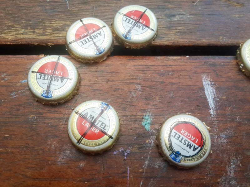 Use a pen to mark a X and Os on the bottle tops