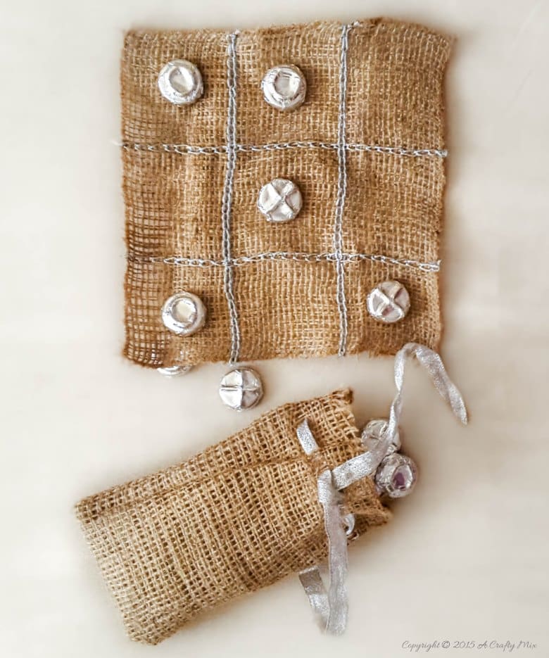 Repurpose bottle tops and make this easy tic tac toe in a bag. #ACraftyMix