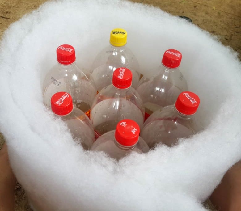 Wrap two layers of batting around the plastic bottles
