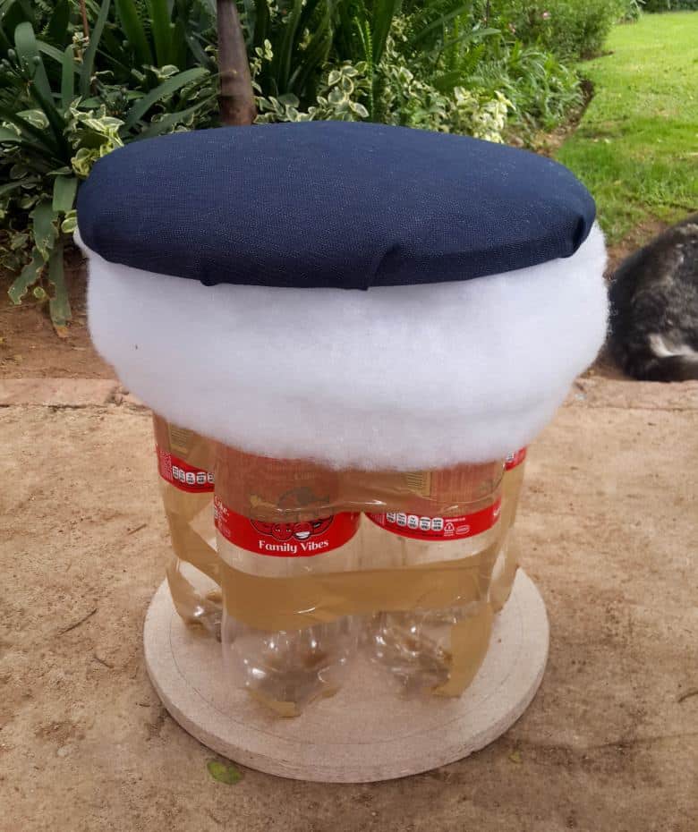 Place the seat on top of the bottles