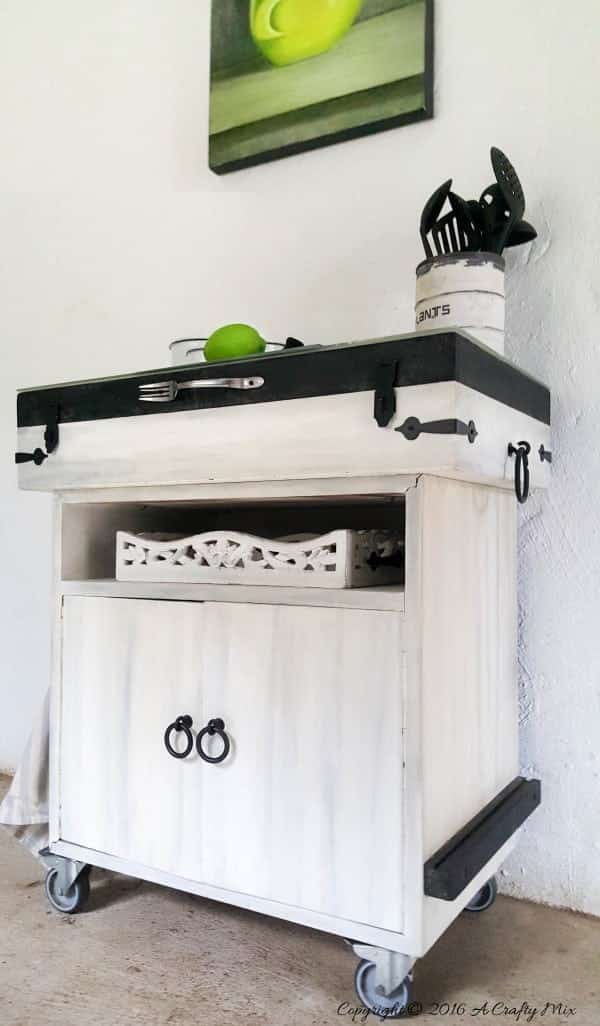 So many thrift store finds can be used to make a kitchen island. Here we used a fishing tackle box and office storage to create this one. #KitchenIslandDIY #Repurposed #ACraftyMix #ThriftStoreFinds