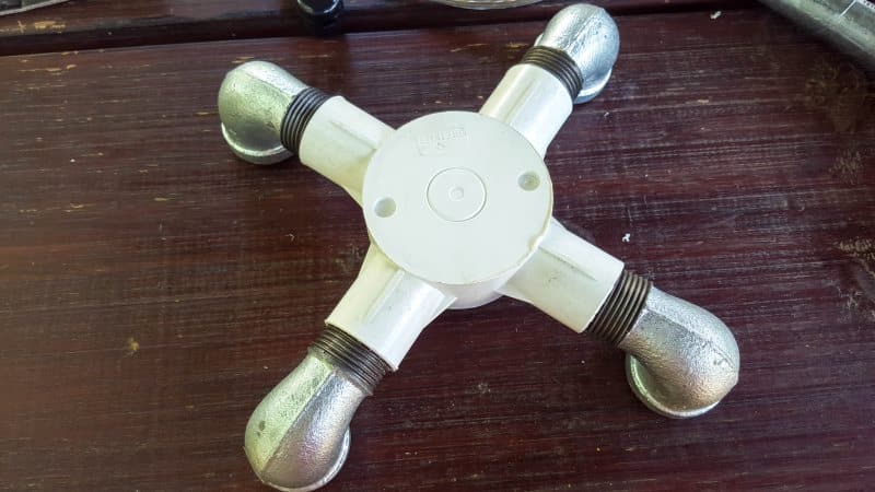 Plumbing bits and galvanized elbows for a base