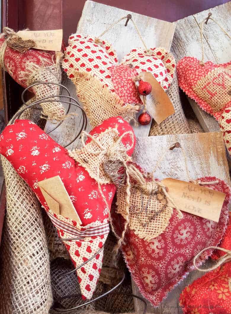 Primitive hearts and bed springs make an awesome Valentine's gift. Quick and easy with tips on adding simple interest and free label printables #FolkArt #ValentinesDay #ACraftyMix #PrimitiveCrafts