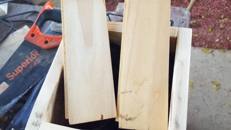 Cut two planks for the bottom