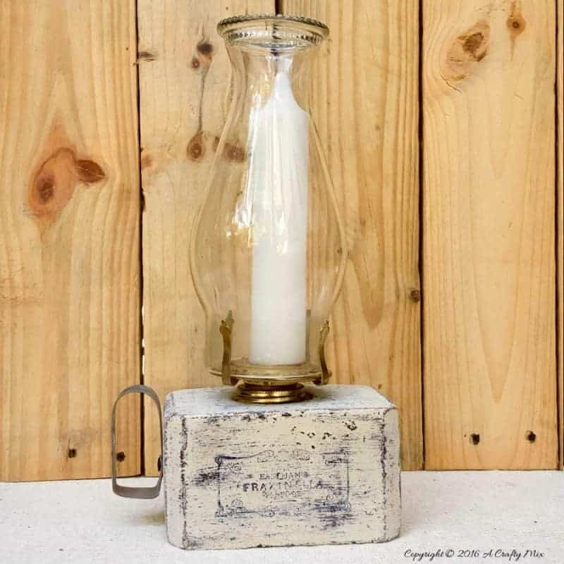 Turn block pallets into these rustic farmhouse lanterns. Quick and easy recycled idea. #pallets #repurposedDecor #ACraftyMix #FarmhouseDecor