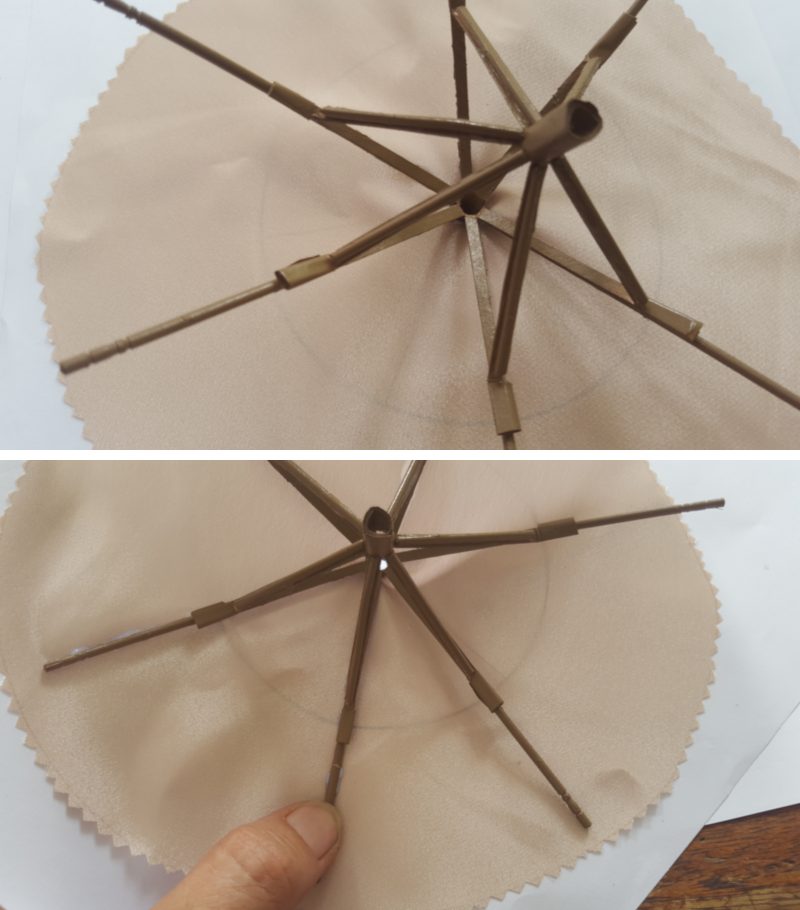 Glue the fabric on to the umbrella frame