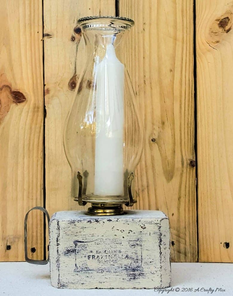 Turn block pallets into these rustic farmhouse lanterns. Quick and easy recycled idea. #pallets #repurposedDecor #ACraftyMix #FarmhouseDecor