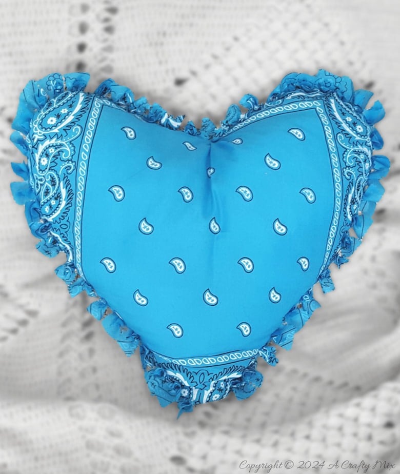 Fall in love with this adorable no-sew bandana heart pillow! Get crafty with us and learn how to create your own heart-shaped masterpiece using your favorite bandanas. Perfect for decorating, gifting, or even just to cuddle up with.