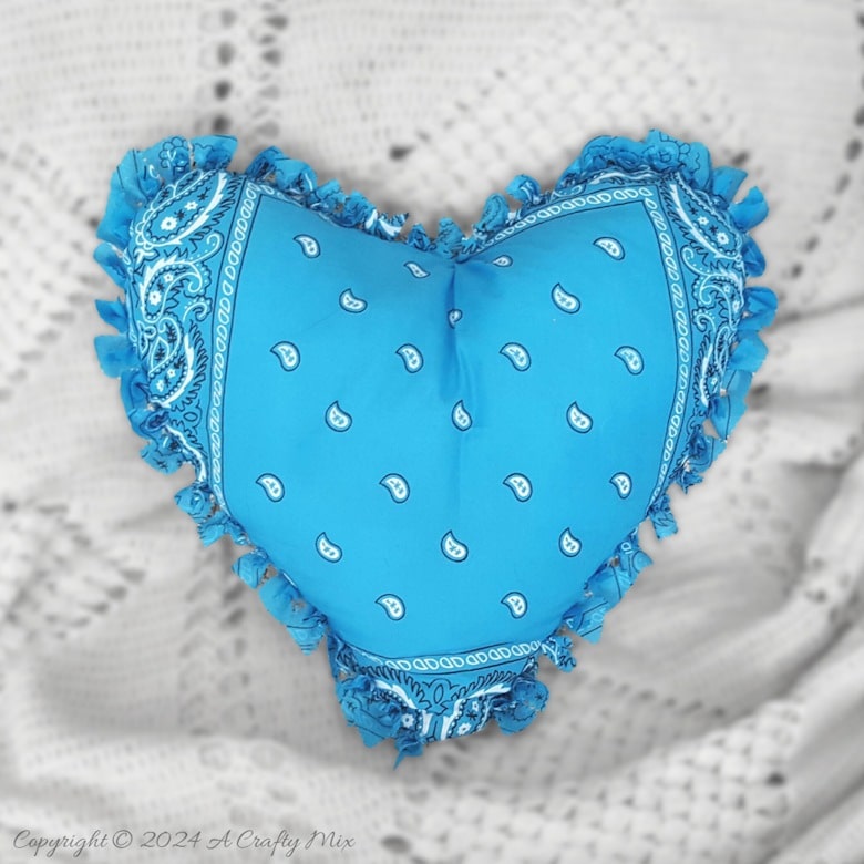 Fall in love with this adorable no-sew bandana heart pillow! Get crafty with us and learn how to create your own heart-shaped masterpiece using your favorite bandanas. Perfect for decorating, gifting, or even just to cuddle up with.