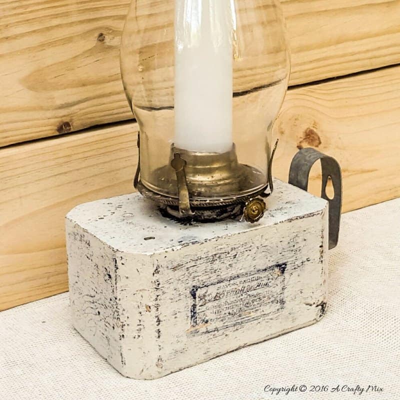 Turn block pallets into these rustic farmhouse lanterns. Quick and easy recycled idea. #pallets #repurposedDecor #ACraftyMix #FarmhouseDecor