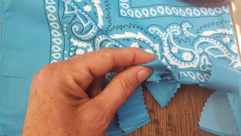 Push the folded over strips up and through the slits