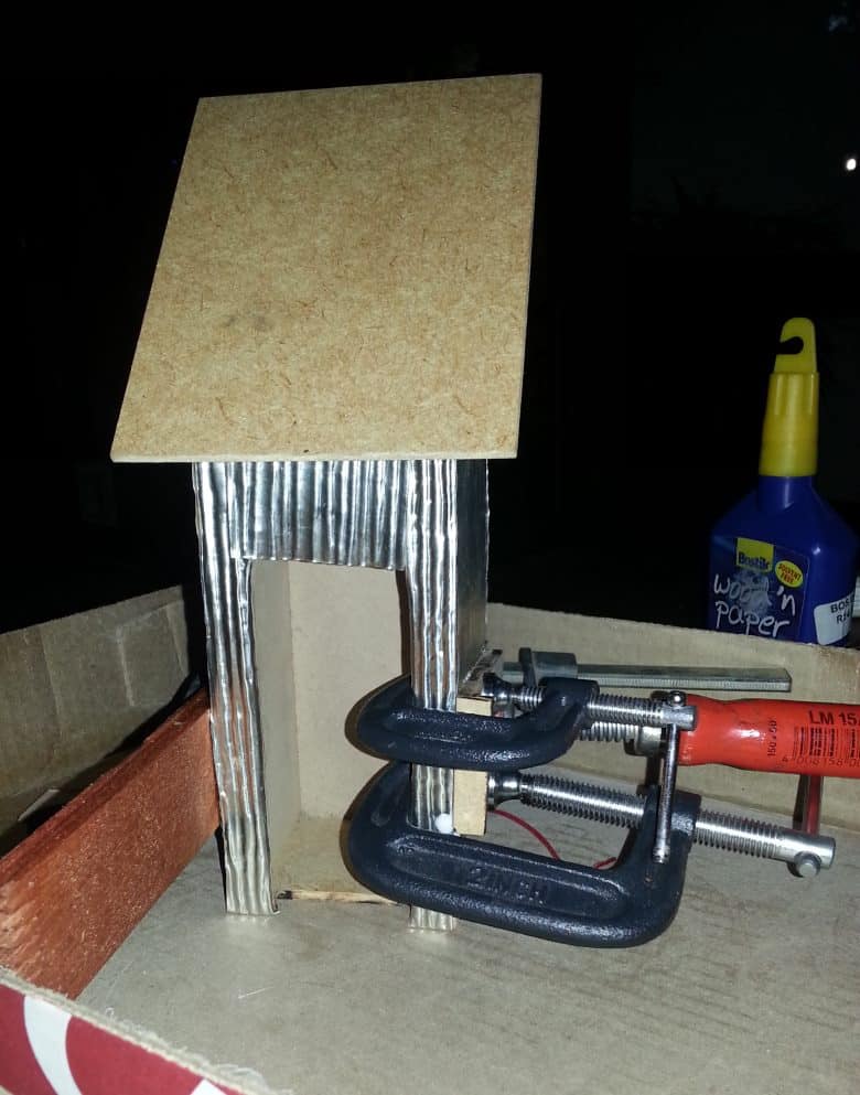 Clad the outside of the outhouse with scored pewter