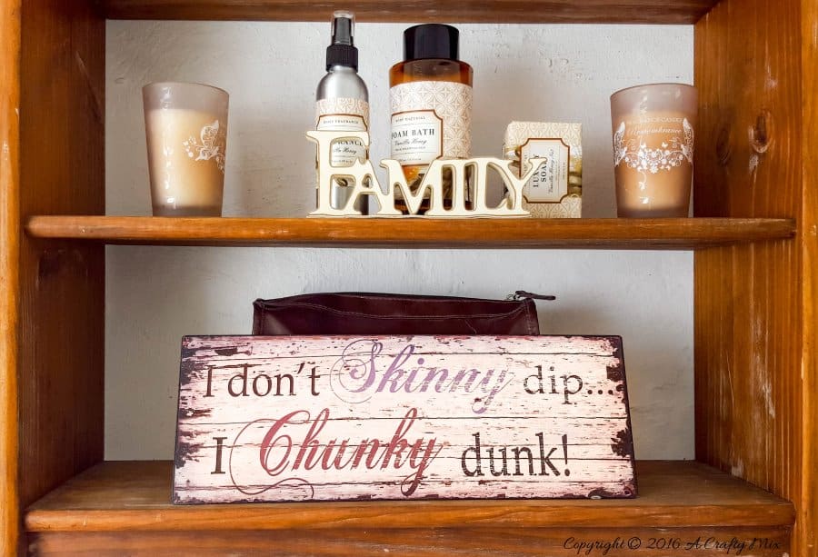 A thrifted shelf hung on the wall holds all our bathroom accessories #ACraftymix #StorageSolutions #SmallSpace
