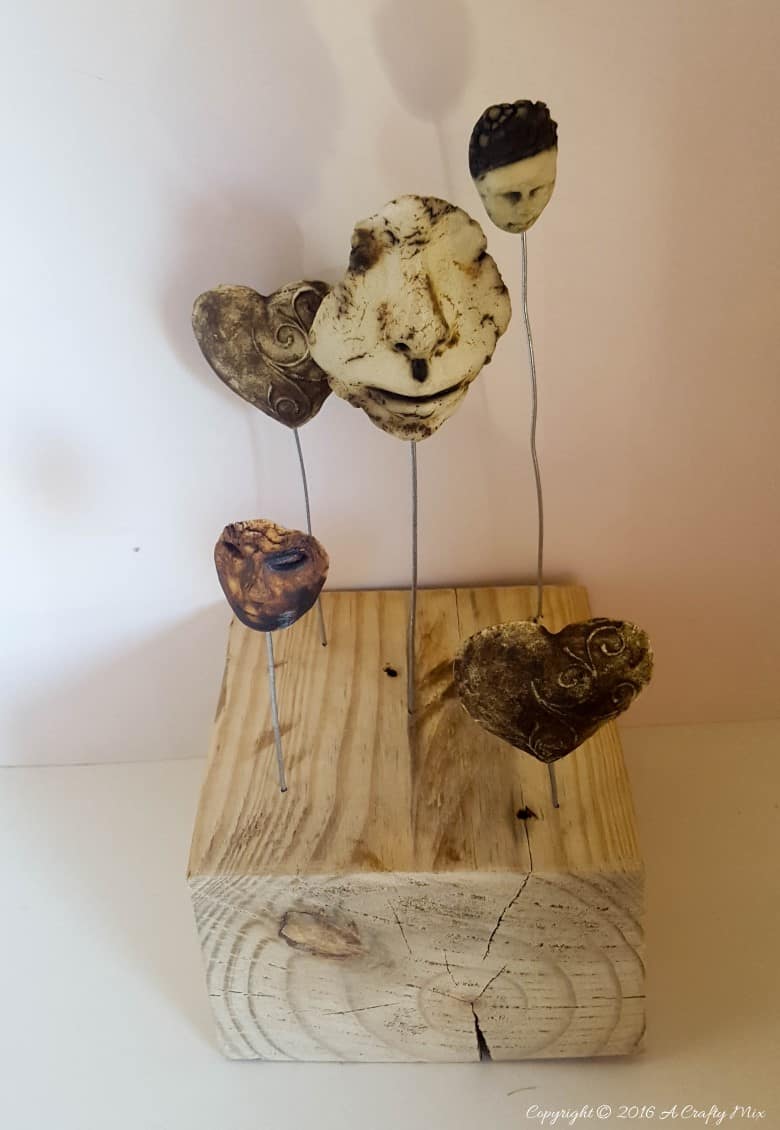 Turn broken pottery bits into home decor. Quick and easy repurpose #BrokenPottery #ACraftyMix #BrokenArt