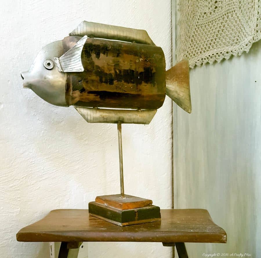 I love unusual decor item and this metal and scrap wood fish is no exception