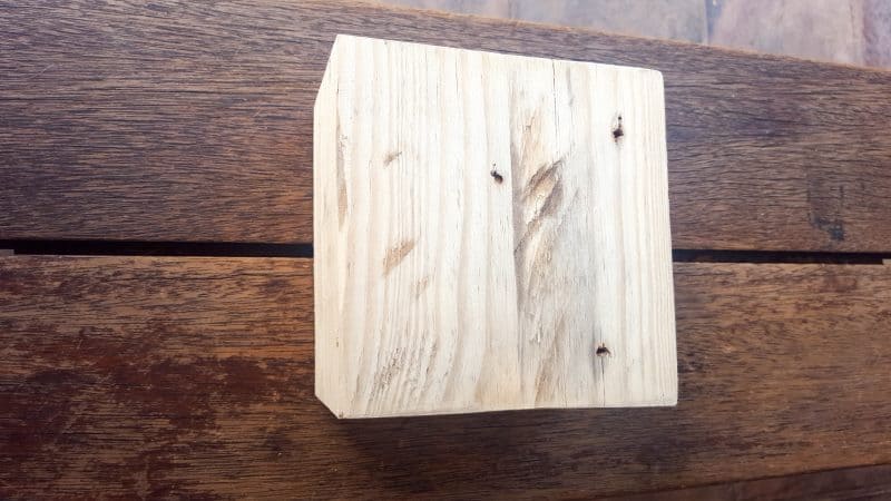 Sand the wood block smooth and drill holes