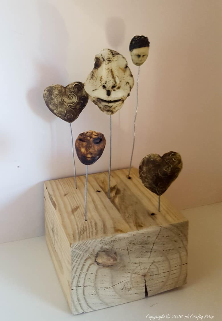 Turn broken pottery bits into home decor. Quick and easy repurpose #BrokenPottery #ACraftyMix #BrokenArt