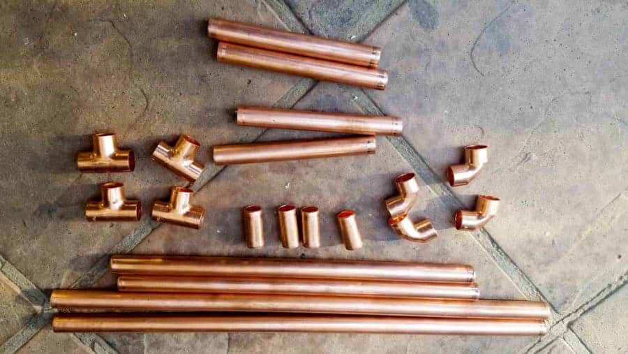 Repurpose an old sweater and copper pipes into a DIY bed for your purr babies. It's quick and easy to do, and a great way to recycle an those old sweaters! Your kitties will love it. #DIYCatBed #DIYPets #DIYHome #PetFriendly