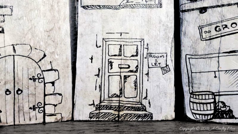 Turn scrap wood and recycled sandwich containers into a cute cartoon village for the kids.