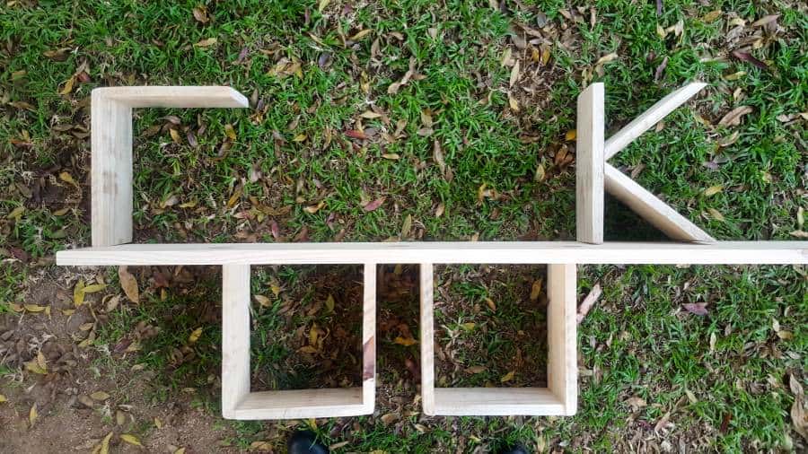 The C O O & K arranged on the shelf prior to painting and staining