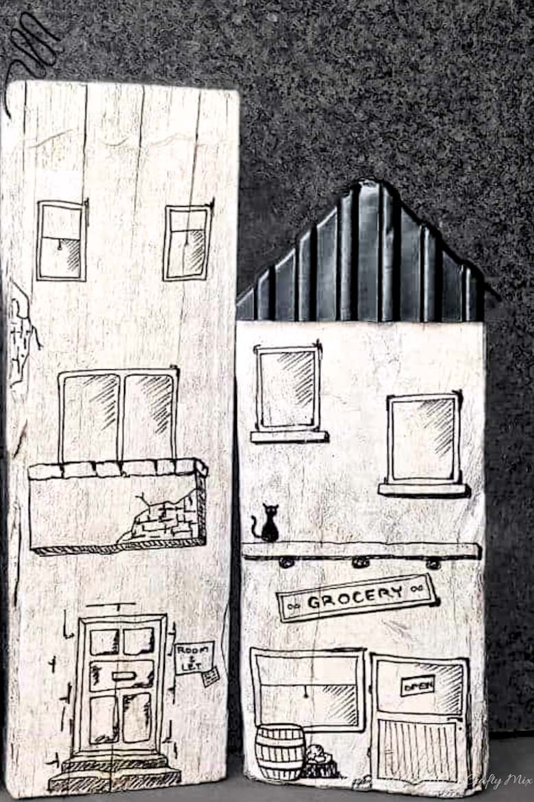 Turn scrap wood and recycled sandwich containers into a cute cartoon village for the kids.