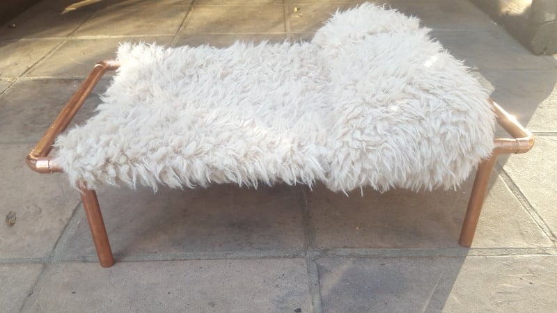 Repurpose an old sweater and copper pipes into a DIY bed for your purr babies. It's quick and easy to do, and a great way to recycle an those old sweaters! Your kitties will love it. #DIYCatBed #DIYPets #DIYHome #PetFriendly