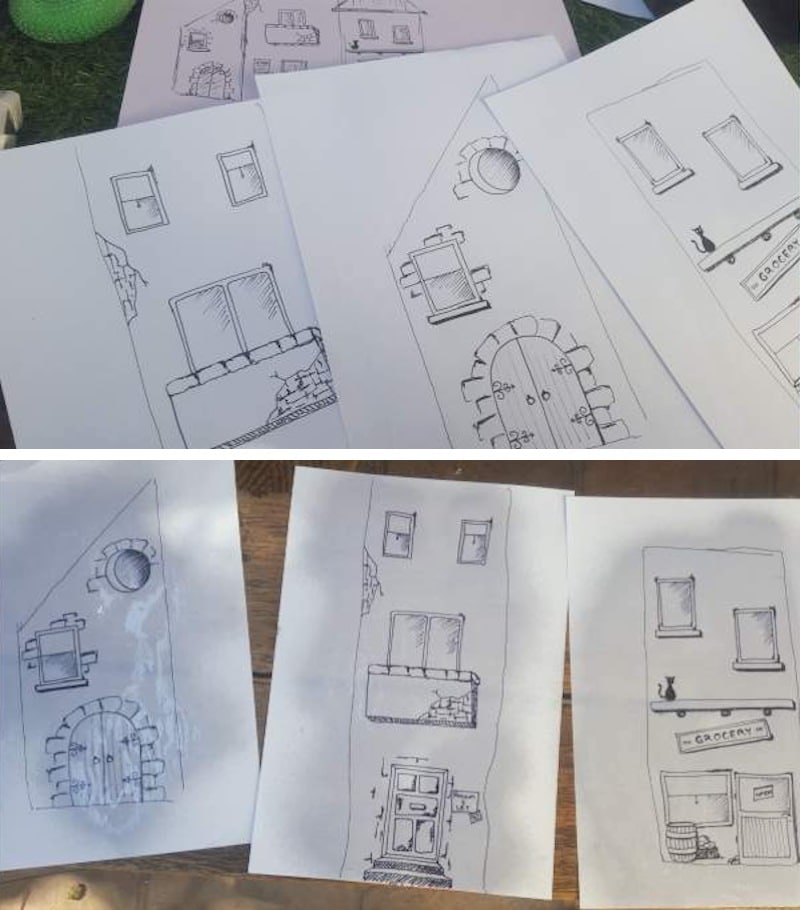 Transfer the cartoon village image and seal with artist fixative