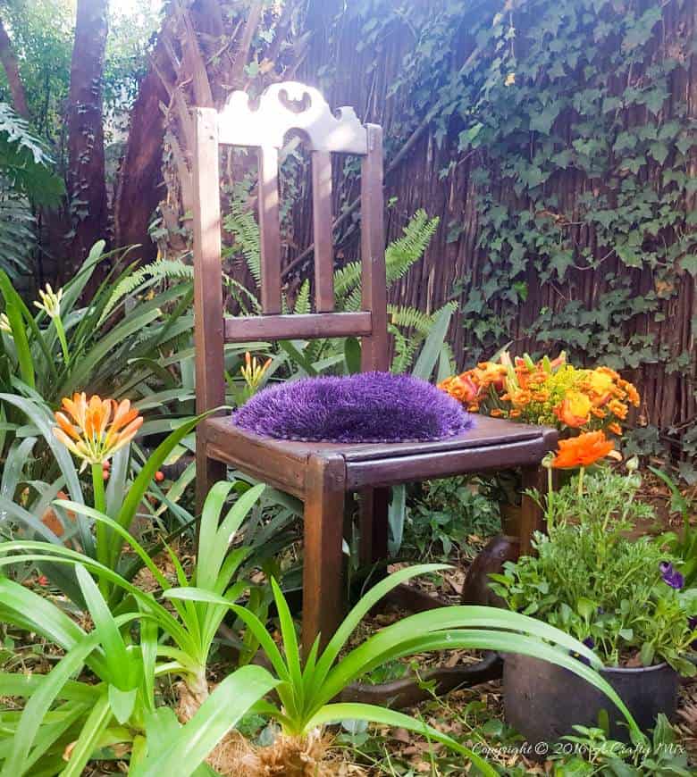 Celebrating nature and a well loved chair in true gypsy style. Bold beautiful colors and tactile fabrics mixed with well worn wood. What more do you need to add some boho magic to your decor? #gypsyDecor #chairrepurpose #ACraftyMix #heartcushion #bohodecor