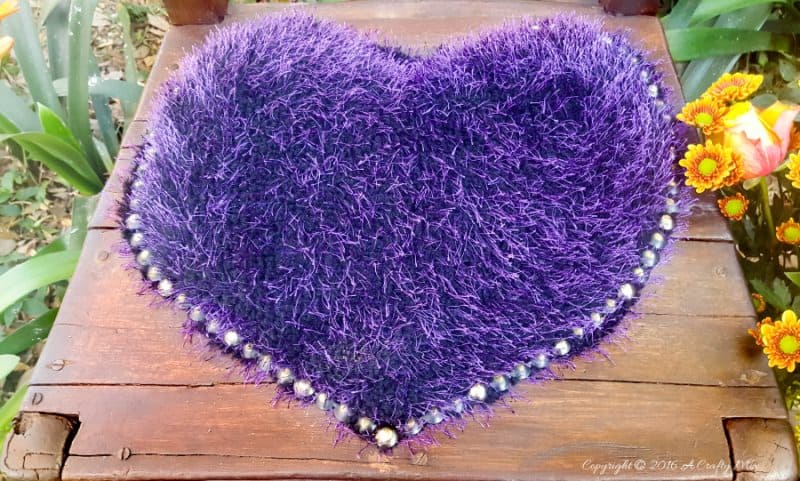 Celebrating nature and a well loved chair in true gypsy style. Bold beautiful colors and tactile fabrics mixed with well worn wood. What more do you need to add some boho magic to your decor? #gypsyDecor #chairrepurpose #ACraftyMix #heartcushion #bohodecor