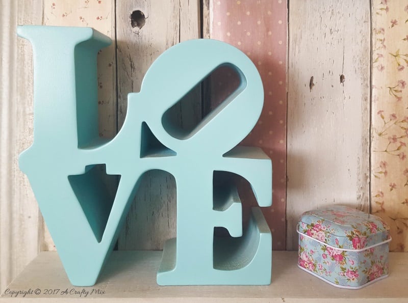 Love sign on the pallet scrapbook shelf