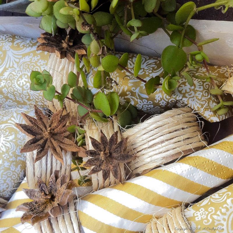Quick and easy fall napkin rings using cardboard rolls, string and seeds