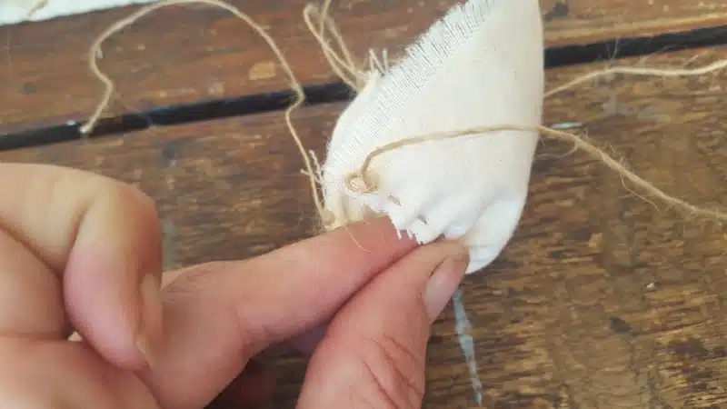 Make a knot at the top and bottom of the hammock to secure the gathers