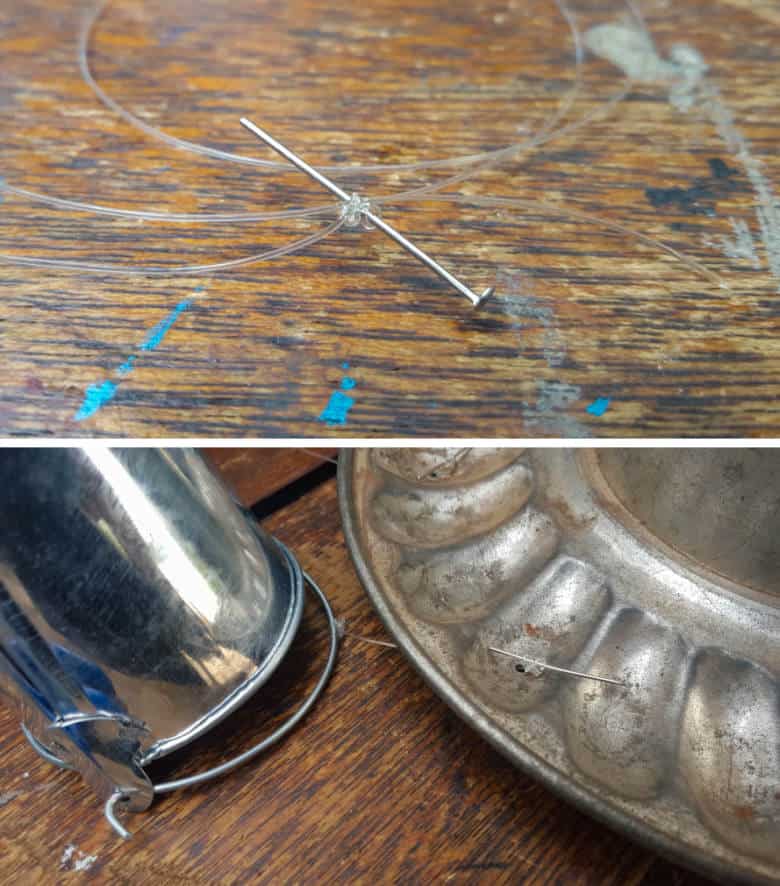 Wrap fishing line around a pin and push the pin up through the holes in the jelly mold