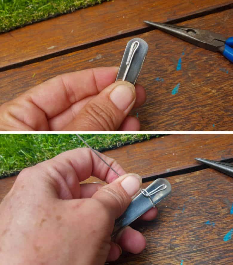 Place the small loop on the back of the spoon and start wrapping the wire around the spoon to secure