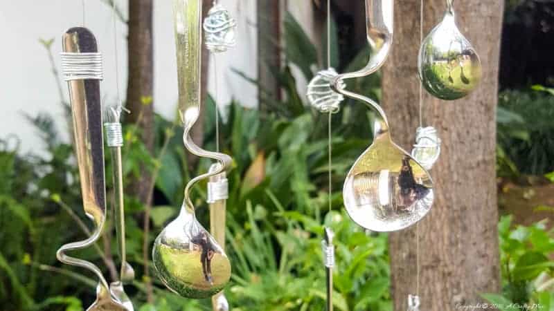 Combine curved spoons and wire wrapped glass beads to make this repurposed wind chime