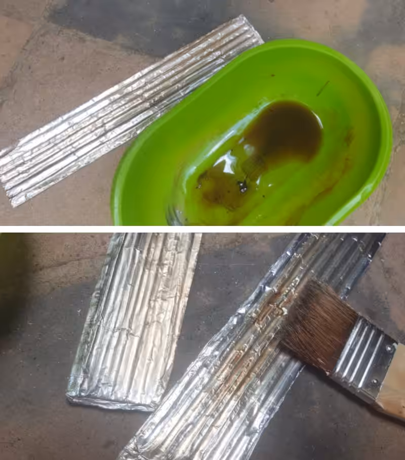 Use oil paint thinned with turpentine to add some faux rust to the roof