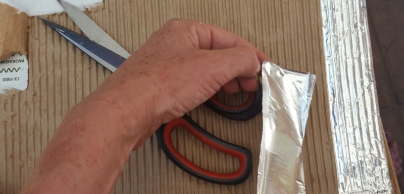 Cover the corrugated cardboard with aluminium tape