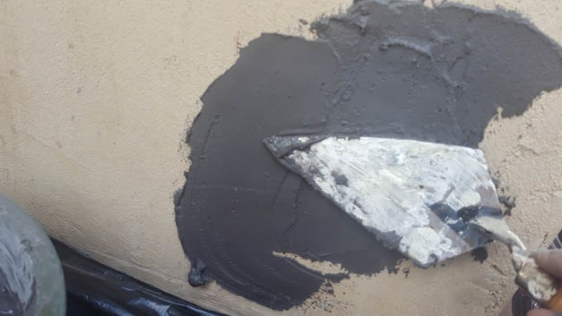Apply the grout adhesive with a trowel