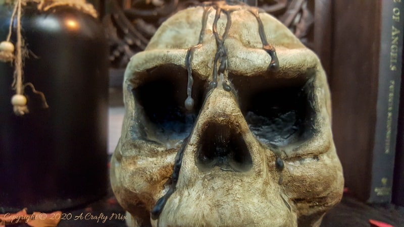 This easy to follow tutorial will show you how to age a Styrofoam or polystyrene skull and give it a spooktacular skull makeover. Can be used as a Halloween display or as a candle holder. #ACraftyMix