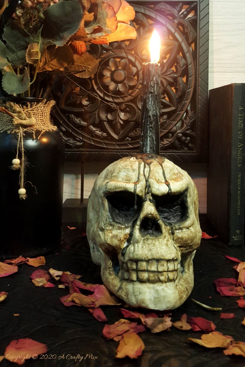 This easy to follow tutorial will show you how to age a Styrofoam or polystyrene skull and give it a spooktacular skull makeover. Can be used as a Halloween display or as a candle holder. #ACraftyMix