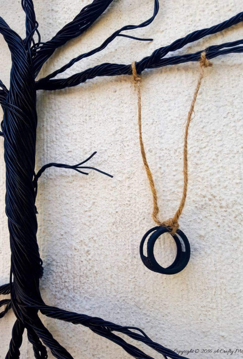 Have you ever considered upcycling a bent bicycle wheel into beautiful garden decor? This beginner-friendly tutorial will should you how easy it is to turn that wheel into a tree of life. #wireworks #ACraftyMix #GardenDecor