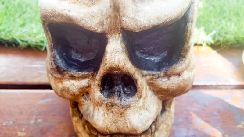 This easy to follow tutorial will show you how to age a Styrofoam skull and give it a spooktacular skull makeover and turn it into a candle holder. #HalloweenDecor #HalloweenCraft #ACraftyMix #Halloween #SkullCrafts #SkullCandle