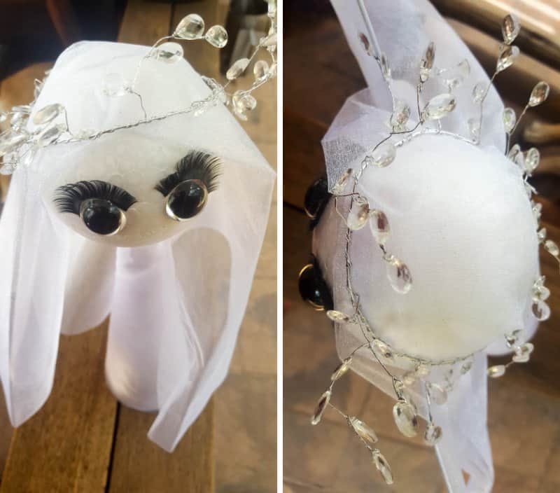 Drape gauzy fabric over the angels head and add some beads