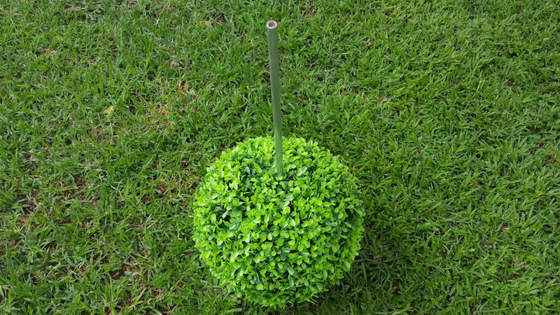 Add the biggest topiary ball to the bottom